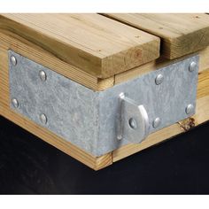 a wooden box with metal latches on it