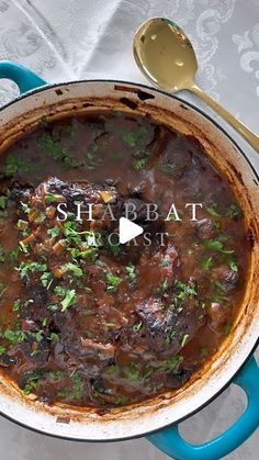 a pot filled with stew sitting on top of a table