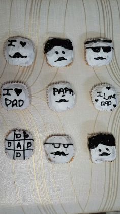 some cupcakes that have been decorated to look like dad's mustaches