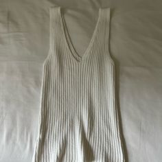 Brandy Melville Knit Top Never Worn, Excellent Condition No Tags Perfect For The Summer V-neck Pointelle Knit Tops For Loungewear, Ribbed Cotton V-neck Sweater Vest, White Textured Knit V-neck Sweater Vest, Cotton V-neck Sweater For Day Out, Loungewear Pointelle Knit Tops, Cozy Pointelle Knit Tops For Loungewear, White Ribbed Knit Tops, Pointelle Knit Tops For Loungewear, Cozy Fitted Tops For Day Out