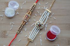 the beads are being beaded together with red thread and some other things to make it