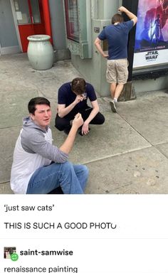 two men sitting on the sidewalk with their arms around each other and one man holding his head