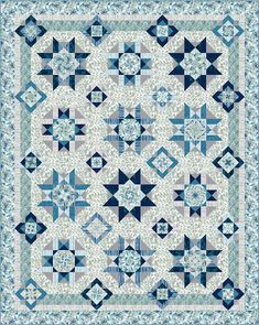 a blue and white quilt with an intricate design on the front, along with two rows of stars