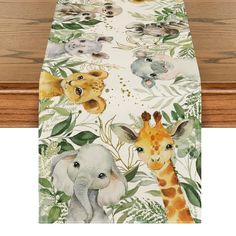 an elephant, giraffe and zebra print table runner