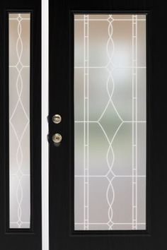 two black doors with frosted glass on them