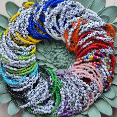 a bunch of bracelets that are on top of a flower