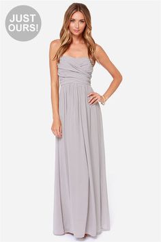 a woman in a gray dress is on sale