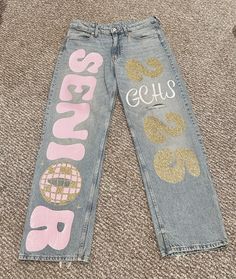 #2025 #senior #seniorjeans #cricket Home Coming Painted Jeans, Senior Jumpsuit Ideas, Spirit Jeans Ideas Homecoming, Senior Jeans Pink And White, Spirt Jeans Homecoming, Senior Pants Ideas Pink, Senior Denim Jeans, Class Of 2025 Senior Jeans, Sophomore Hoco Jeans