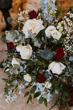 a bouquet of flowers sitting on top of a table