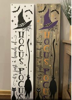 two wooden signs with witches on them