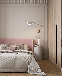 a bedroom with a pink bed and white walls