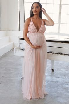 Paige is sleek and classy with her lace pleated bust detail and her sheer train. She dreamy and will have you and your bump on the best bump list. The Paige Fully-lined, and super lightweight fabric with a soft stretchy waistband, for yours and your baby’s comfort. Available in 3 colours: Pink, Blue, Paige Model is 32 weeks, wearing a small. Pink Baby Shower Dress, Maternity Occasion Wear, Pink Maternity Gown, Tulle Baby Shower, Babyshower Dress, Vestidos Para Baby Shower, Elegant Maternity Dresses, Baby Shower Outfit For Guest, Lace Maternity Gown