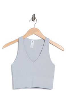 This seamless tank top features an abbreviated hem and waffle stitching to offer a comfy fit whether lounging or being active. V-neck Sleeveless 96% nylon, 4% spandex Machine wash, tumble dry Imported V-neck Yoga Tank Top For Spring, Seamless Sports Tops For Summer, Summer Sports Tops With Seamless Design, Seamless Summer Sports Tops, Athleisure V-neck Crop Top For Summer, Summer V-neck Athleisure Crop Top, Seamless V-neck Tank Top For Gym, Seamless V-neck Athleisure Top, Seamless V-neck Yoga Crop Top