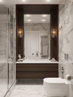 a modern bathroom with marble walls and flooring