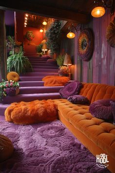 an orange and purple couch sitting on top of a carpet covered floor next to stairs