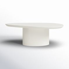 a white round table with an oval base on the top and bottom, in front of a light gray background