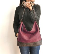 This hobo bag is made of high quality vegan leather in burgundy and dark brown. It is soft and lightweight but durable. It has a rustic, distressed look. It has two interior pockets and a zippered exterior pocket. It has a slouchy silhouette and plenty of room for your daily needs. Measurements: 31 x 30 x 13 cm IMPORTANT! Your orders between 7-25 August will be shipped on August 28. Delivery takes 2-5 days to the US, Canada, Australia and Europe; in 3-7 days to rest of the world after shipping. Versatile Burgundy Shoulder Bag For Everyday, Everyday Large Capacity Burgundy Hobo Bag, Burgundy Soft Leather Hobo Bag For Errands, Soft Leather Burgundy Hobo Shoulder Bag, Burgundy Soft Leather Hobo Shoulder Bag, Burgundy Soft Leather Crossbody Hobo Bag, Burgundy Leather Handle Hobo Tote Bag, Burgundy Leather Tote Hobo Bag, Burgundy Soft Leather Hobo Tote Bag