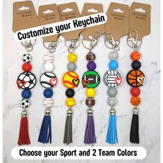 a bunch of key chains with different designs on them