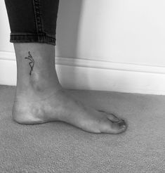 a person with a small tattoo on their foot