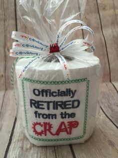 a wrapped gift bag that says officially retired from the crap