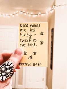 someone holding up a note that says, kind words are like honey and sweet to the soul