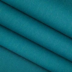 a close up shot of the teal blue fabric