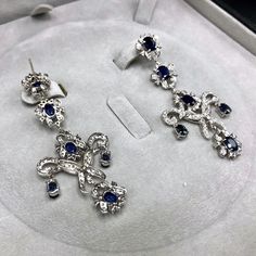 ENJOY OUR WORRY-FREE SERVICE AND THE DAZZLING, GENUINE JEWELRY WE DESIGN AND HANDCRAFT WITH LOVE❤️ ABOUT THE ITEM: A true MASTERPIECE, CHANDELIER EARRINGS, FEATURING 12 PIECES OF TOP GRADE, VIVID BLUE, FULLY TRANSPARENT, SIAMESE BLUE SAPPHIRES, weighting a total of 10.42 carats & over 232 pieces of E/VS DIAMONDS. With total diamonds weight at a WHOOPING 2.61 carats!! Set in ONE OF A KIND 18K SOLID WHITE GOLD, ENORMOUS CHANDELIER EARRINGS! (18 grams of gold weight) WORLD-CLASS MASTERPIECE NOW Wedding Royal Blue, Huge Wedding, Wedding Royal, Vs Diamond, Free Service, Cornflower Blue, Chandelier Earrings, Handmade Earrings, Pandora Charm Bracelet