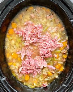 a crock pot filled with meat and vegetables