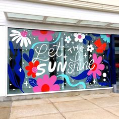 a store front with the words let it shine written in large letters on the window