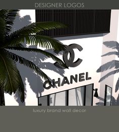 a building with a palm tree in front of it and the name chanel on the side