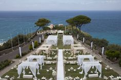 an aerial view of a wedding venue overlooking the ocean