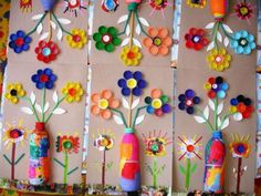 the wall is decorated with colorful flowers and vases on paper mache boards,