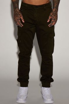 Available InBlack, Khaki, Olive, And Camouflage. Model Height: 6'2 - Waist: 32 - Wearing Large Big & Tall: Height 6'3 - Waist 42 - Wearing XXXL Button Closure Zip Fly Cargo Pants Elastic Hem Front And Back Pockets Cargo Pockets 31 Inseam 98% Cotton 2% Spandex Imported | Mens Kryptonite Cargo Pants in Olive Green size 30 by Fashion Nova Fitted Combat Bottoms With Cargo Pockets, Fitted Camouflage Bottoms With Cargo Pockets, Military Style Fitted Bottoms With Side Pockets, Fitted Military Bottoms With Side Pockets, Military-style Fitted Bottoms With Side Pockets, Fitted Military Style Bottoms With Side Pockets, Fitted Green Cargo Pants For Streetwear, Stretch Camouflage Bottoms With Pockets, Casual Olive Bottoms With Multiple Pockets