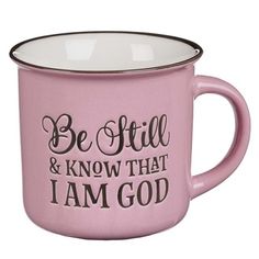 a pink coffee mug with the words be still and know that i am god on it