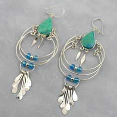 These beautiful boho earrings feature green chrysocolla stone piece in alpaca silver metal, a beautiful earring design. These artisan-made exotic earrings measure approx 3.25 inches long. Strong construction although delicate in looks. Colorful stone and metal bohemian earrings with authentic semi precious gemstones comfortable and fun to wear. Stylish and versatile ethnic earrings, you will be able to pair them in line with your favorite party dress or put them on casually with jeans and t-shir Green Statement Earrings, Black Statement Earrings, Ethnic Earrings, Earrings Green, Red Earrings, Geometric Jewelry, Bohemian Earrings, Green Earrings, Earrings Statement