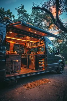 a van is parked on the side of the road with it's doors open