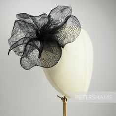 'Myla' is a fabulous large bloom made out of sheer handwoven sinamay. With really large petals, it's accompanied by a single hand-rolled leaf and is all attached to wired stem so you can bend it to sit in your desired position. Simply attach a clip or headband to use as a standalone piece or pop onto a large hat to make a big impact! Mount measures: Flower width: 20cm (7.8 inches) Please note that this range does not coordinate with our standard range of sinamay fabric and trims. Some colours wi Sinamay Fabric, Large Hat, Fancy Dress Outfits, Large Hats, Millinery Hats, Metal Headbands, Macrame Bag, Flower Hats, Bridal Flowers