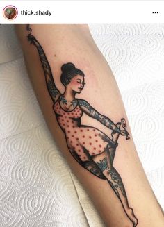 a woman with a tattoo on her leg