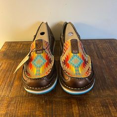 A Brand New Pair Of Ariat Cruisers In The Color Copper Metallic/Rainbow Aztec. They Are Beautiful Shoes That Can Be Worn With Shorts, Jeansanything Youd Like. They Will Come With The Original Box. They Come From A Smoke Free Home. Please Feel Free To Ask Questions! Reasonable Offers Welcome! Aztec Shoes, Ariat Cruisers, Metallic Rainbow, Leather Loafers Women, Leather Boat Shoes, Loafer Shoes Women, Ariat Shoes, Loafer Sneakers, Tassel Loafers