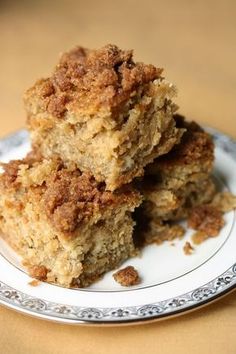 three pieces of cake sitting on top of a white plate