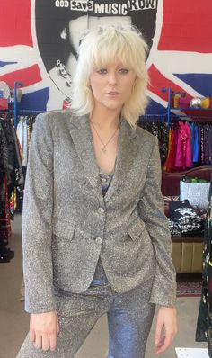 Be rockstar ready in the new Any Old Iron Selector Suit! This sparkly three piece suit entails a blazer, a matching vest, and a pair of flare trousers to complete the look. Depending on how the light hits the suit, shades of blue, silver, and gold can be seen dancing along the fabric. It is a lightweight number that is perfect for any large event, warm venue, or hot stage light. You can wear the three pieces together for a badass formal look or wear the pieces individually to amp up other outfits. Size Guide for Women’s Suits and Sequin Moto XS S M L XL Chest 37 35.5 37 38.5 40 Waist 27 29 30.5 32 34 Hip 34 35.5 37 38.5 40 Arm Length 23.5 24 24.5 25 25.5 Shoulder Across Back 15.5 16 17 18 19 Outside Leg 24 24.5 25 25.5 26 The model is 5'10" and is wearing a size small. This suit is made to Stage Light, Kate Bosworth, Miranda Lambert, Three Piece Suit, Flare Trousers, Other Outfits, Formal Looks, Elton John, Cardi B