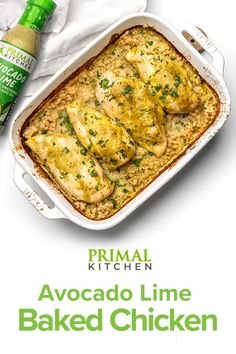 a casserole dish filled with chicken and topped with parsley next to a bottle of prima kitchen avocado lime baked chicken