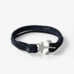 This Midnight Explorer Nautical Rope Bracelet is handcrafted with precision and attention to detail. It features a unique combination of three navy blue nautical ropes with varying thicknesses. The bracelet's sleek design is perfect for adventurers who seek a minimalistic yet bold accessory. The choice of 6 quality stainless steel clasps offers a touch of elegance and durability to this handmade bracelet. The Midnight Explorer is not just a bracelet, but a symbol of the endless possibilities that await those who dare to explore the unknown. How to choose the right size for the bracelet: Please measure your wrist and select the EXACT measurement of the wrist. For example, if the wrist measures 18 cm, please select 18 cm the size of the bracelet. If you want to make the bracelet as a gift to Blue Bracelets With Stainless Steel Clasp As A Gift, Silver Nautical Bracelets As A Gift, Navy Nautical Bracelets As Gift, Adjustable Black Nautical Jewelry, Nautical Anchor Bracelets As Gift, Nautical Anchor Bracelet As Gift, Nautical Anchor Bracelet Gift, Adjustable Black Nautical Bracelets, Adjustable Black Nautical Bracelet