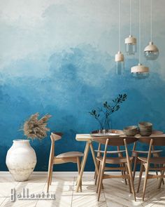 a dining room with blue walls and wooden chairs