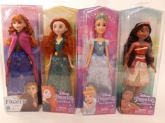 three disney princess dolls in their packaging