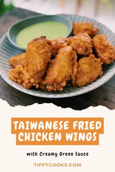 fried chicken wings with creamy green sauce on the side and text that reads, taiwan fried chicken wings with creamy green sauce