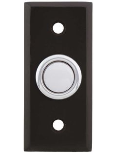 a black and silver door handle with a white button on the left side of it