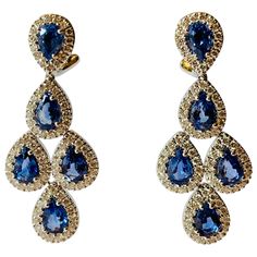 Sophisticated elegance! These earrings feature 10 pear shape blue Sapphires weighing 4.82 ct., accented by 150 brilliant cut Diamonds totaling 1.50 ct, G, vs. These chandelier drop earrings are set in 18K white gold with omega clip backings. Luxury Blue Chandelier Earrings For Formal Occasions, Blue Teardrop Diamond Earrings, Elegant Blue Pear-shaped Diamond Earrings, Formal Blue Pear-shaped Diamond Earrings, Diamond Chandelier, Blue Sapphire Diamond, Lovely Jewellery, Dream Jewelry, Sapphire Diamond