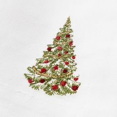 a christmas tree is embroidered onto a white t - shirt with red berries on it