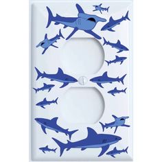 a light switch cover with blue sharks on it